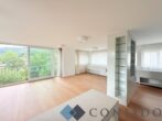 Exklusive Maisonette mit traumhaften Terrassen und unverbaubarem Grünblick in absoluter Ruhelage - Wohnzimmer
