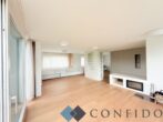 Exklusive Maisonette mit traumhaften Terrassen und unverbaubarem Grünblick in absoluter Ruhelage - Wohnzimmer