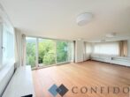 Exklusive Maisonette mit traumhaften Terrassen und unverbaubarem Grünblick in absoluter Ruhelage - Wohnzimmer
